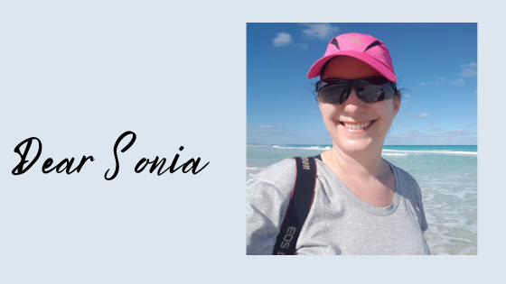 Smiling woman on beach