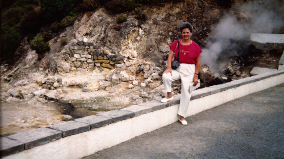 Woman standing next to hot springs in Azores