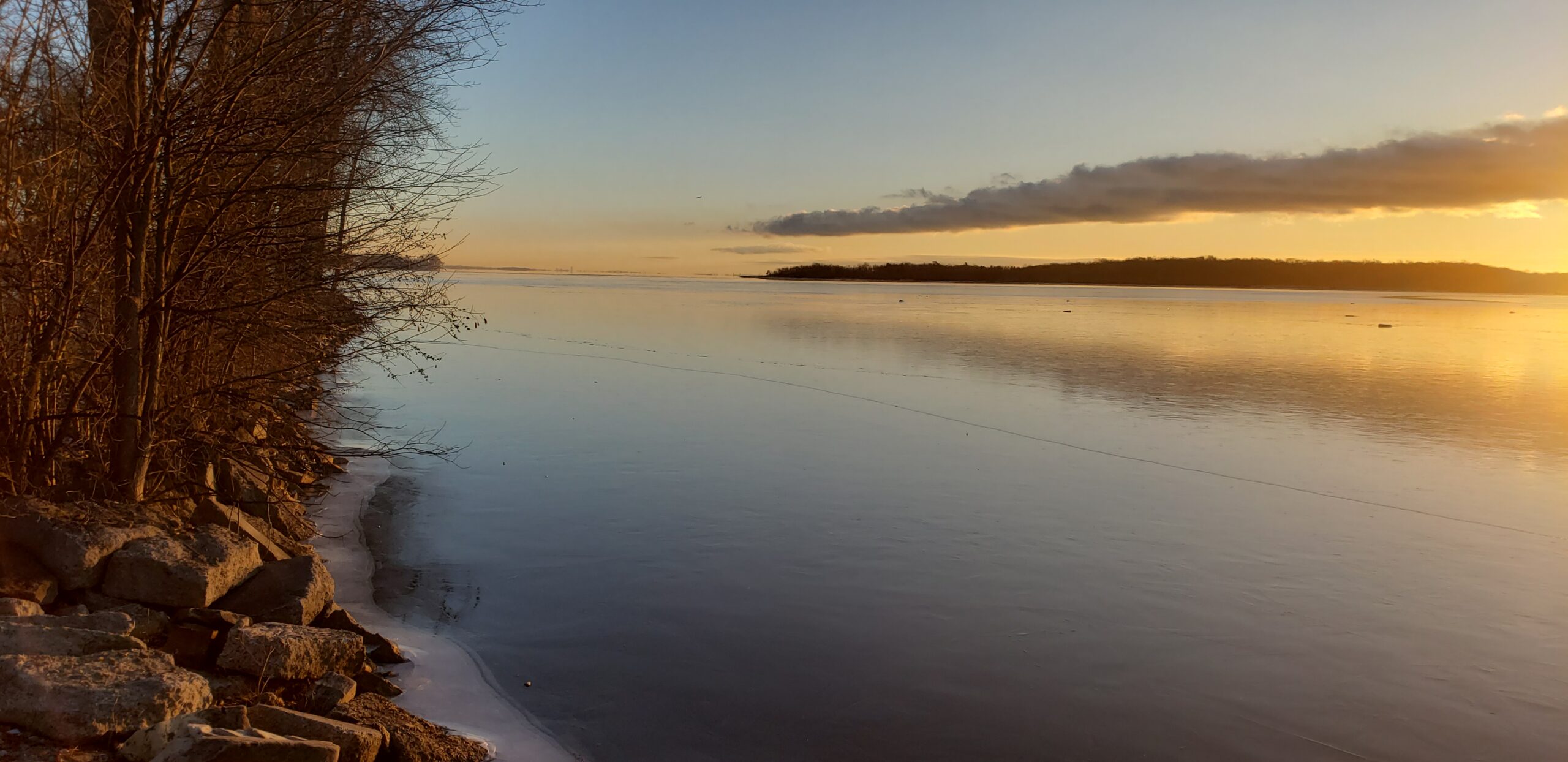 sunrise over frozen lake